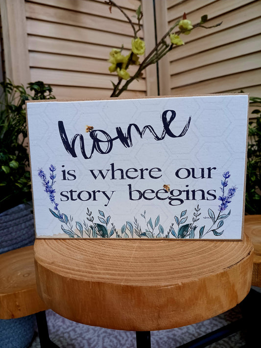 Wood home is where our story begins sign.